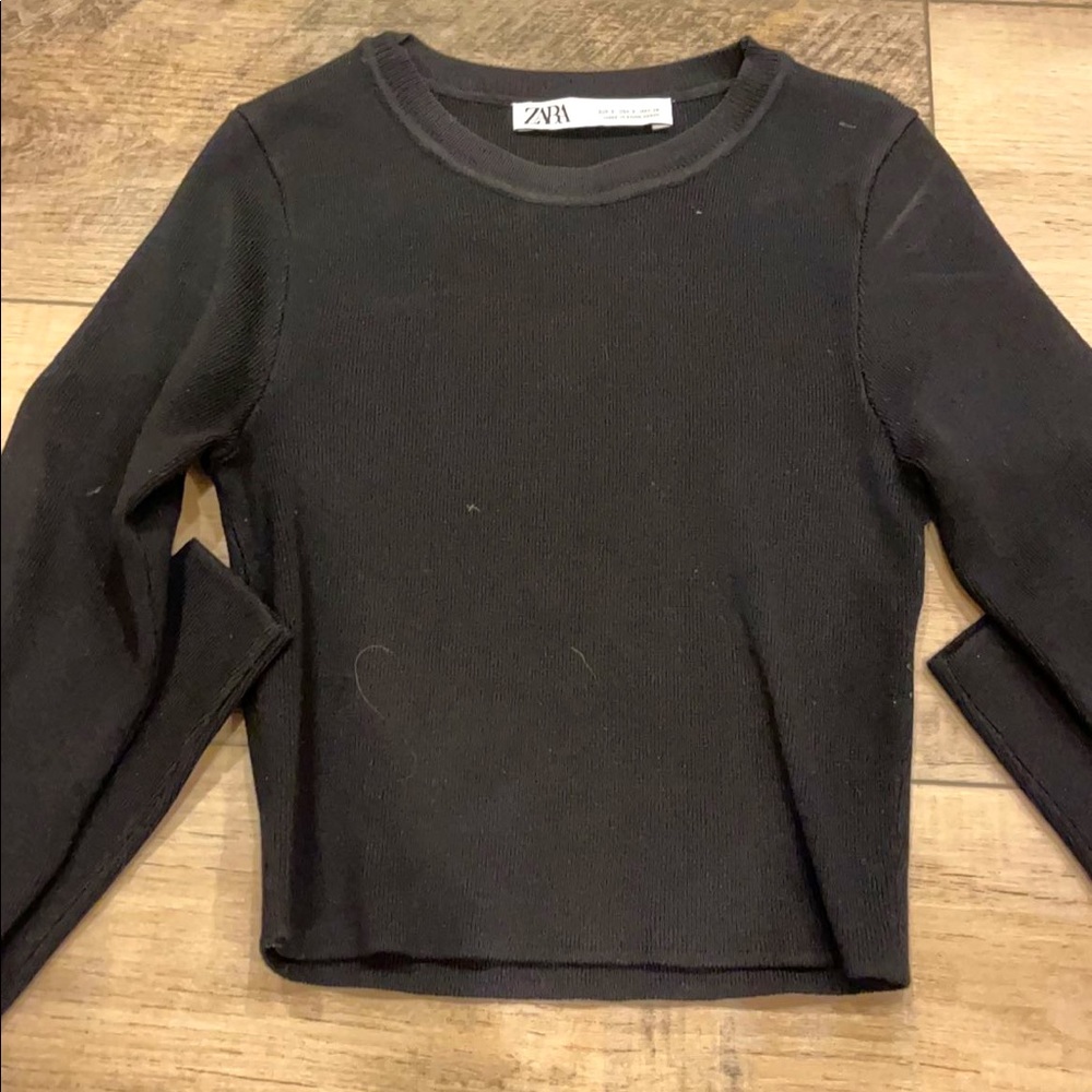 a zara black long sleeve. tight once on but is stretchy when ur putting it on.